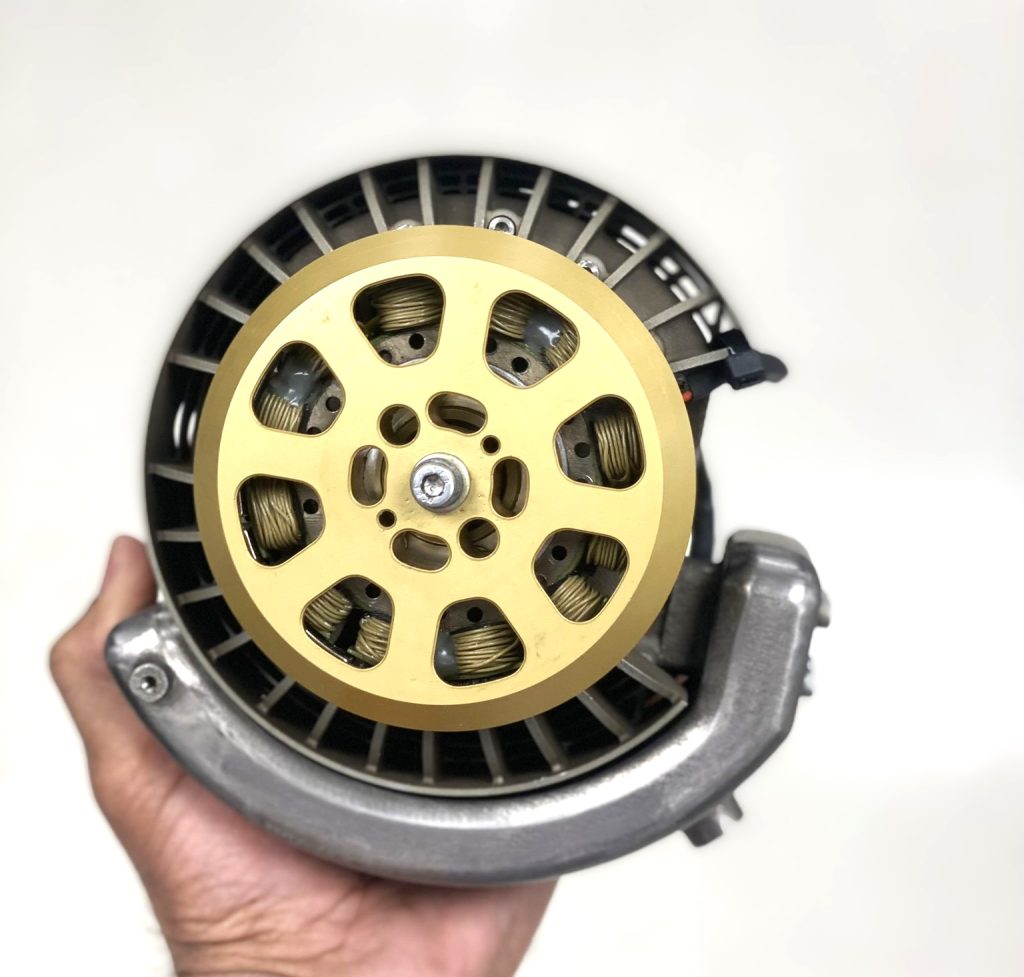 AIE 40ACS 5 HP air-cooled Wankel rotary engine holding in a hand